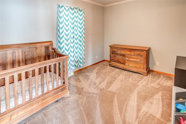 carpeted bedroom with crown molding and a crib