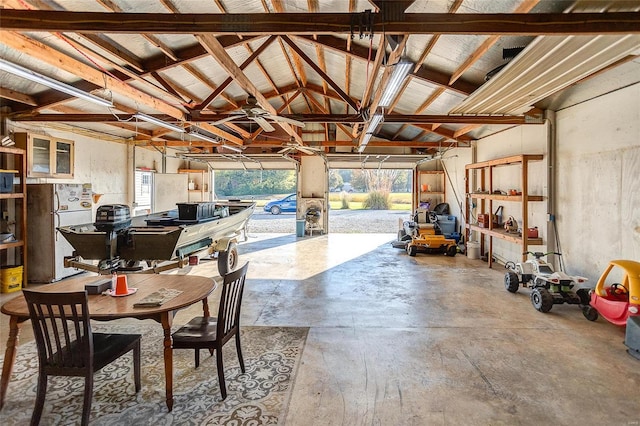 garage featuring ceiling fan and white refrigerator