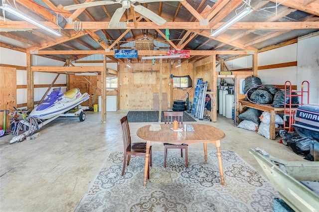 interior space featuring lofted ceiling and concrete flooring