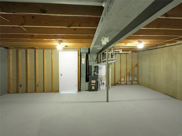 basement with gas water heater and heating unit