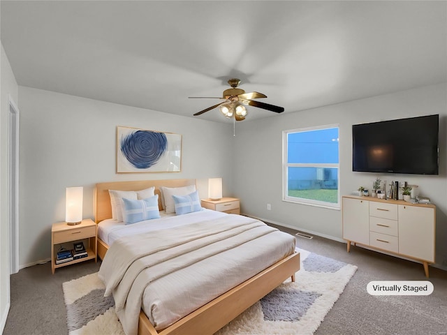 carpeted bedroom with ceiling fan