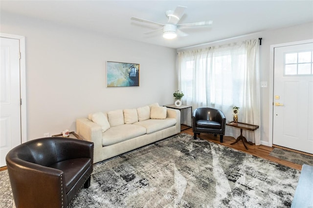 living room with hardwood / wood-style floors and ceiling fan