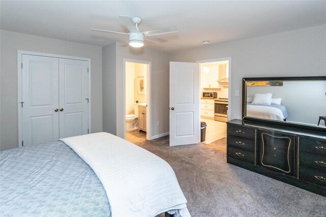 carpeted bedroom with a closet, ceiling fan, and connected bathroom