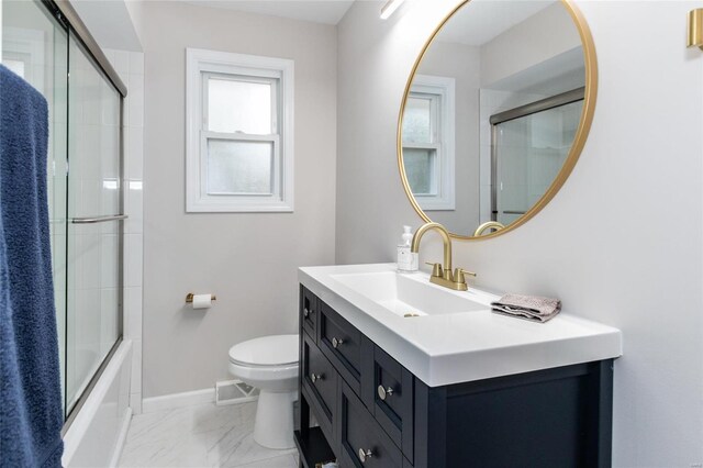 full bathroom with vanity, toilet, and enclosed tub / shower combo