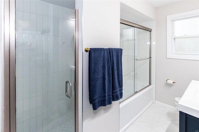 full bathroom with vanity, shower / bath combination with glass door, and toilet