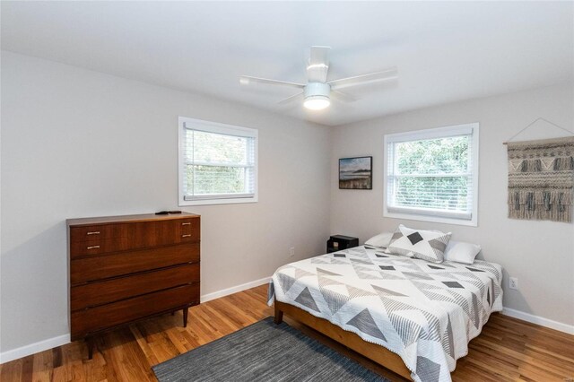 bedroom featuring hardwood / wood-style floors and ceiling fan