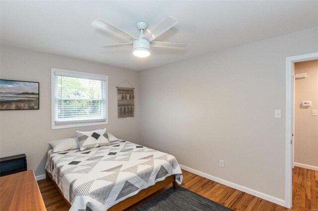 bedroom featuring ceiling fan and wood-type flooring