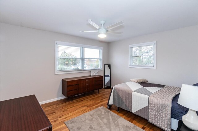 bedroom featuring wood-type flooring and ceiling fan