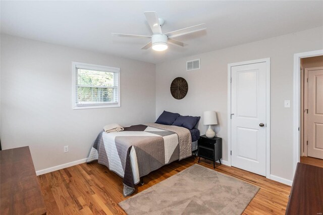 bedroom featuring wood-type flooring and ceiling fan