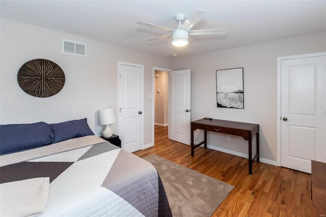 bedroom with hardwood / wood-style flooring and ceiling fan