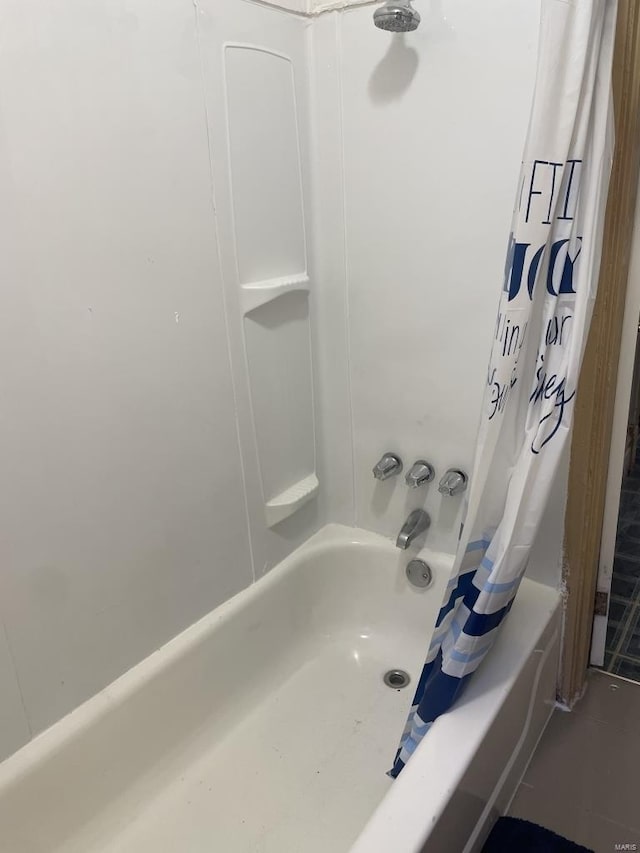 bathroom featuring shower / bath combination with curtain and tile patterned floors