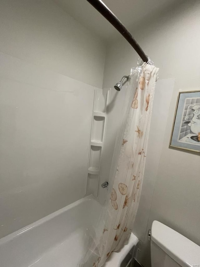 bathroom featuring toilet and shower / bathtub combination with curtain