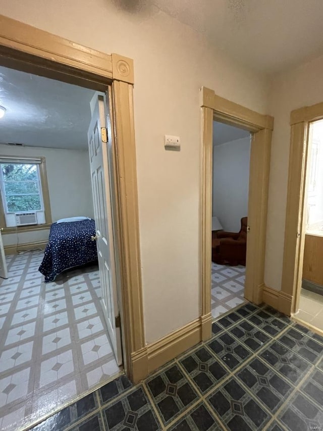 corridor with cooling unit and tile patterned floors