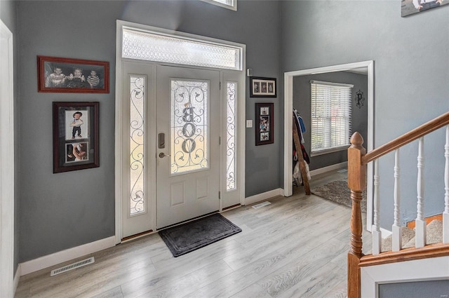 foyer entrance with light wood-type flooring