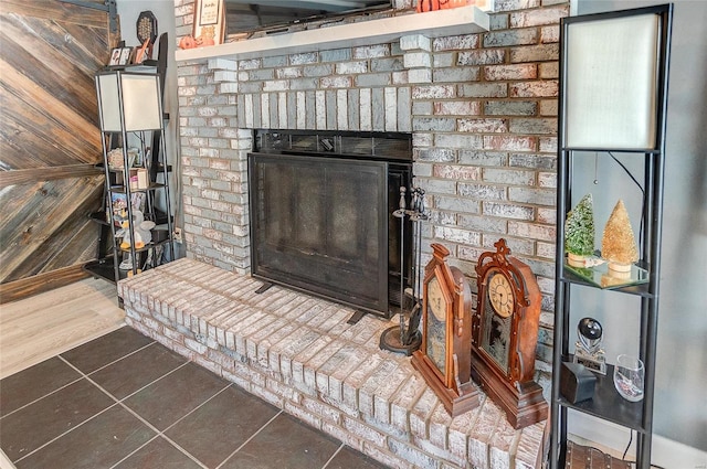 room details featuring tile patterned floors and a fireplace