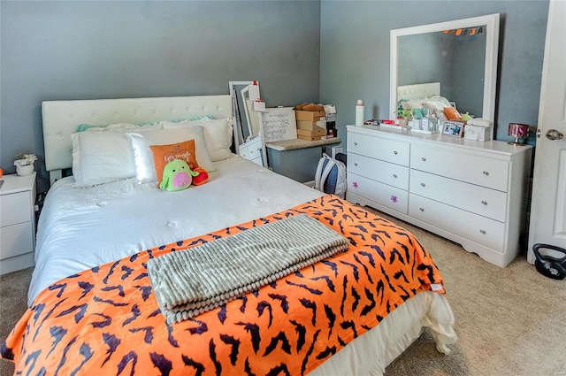 bedroom featuring light colored carpet