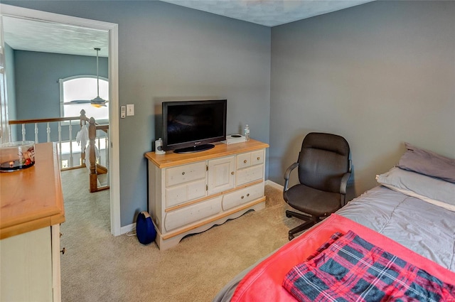 bedroom featuring light carpet