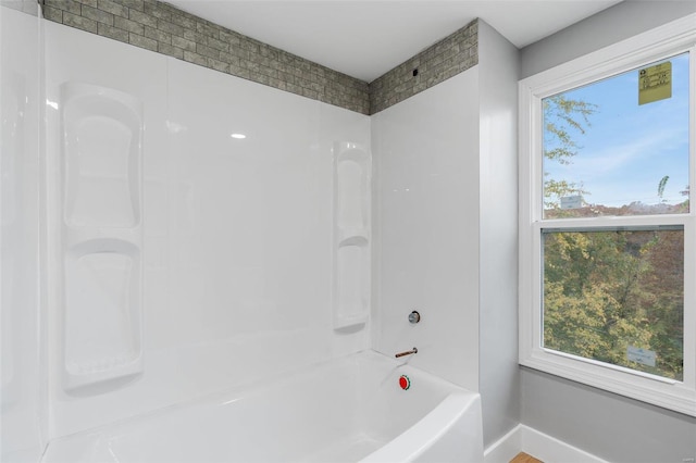 bathroom featuring shower / bath combination and a wealth of natural light