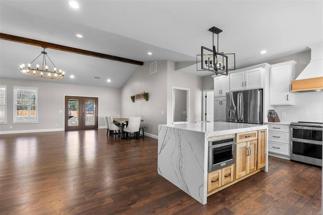 kitchen featuring a center island, white cabinets, dark wood-type flooring, and stainless steel appliances