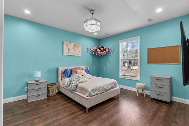 bedroom featuring dark hardwood / wood-style flooring