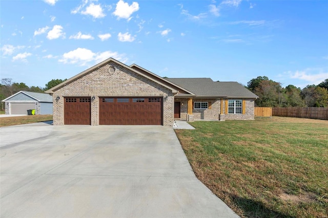 view of front of property with a front lawn and a garage