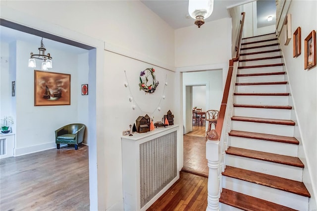 interior space featuring a notable chandelier and hardwood / wood-style flooring