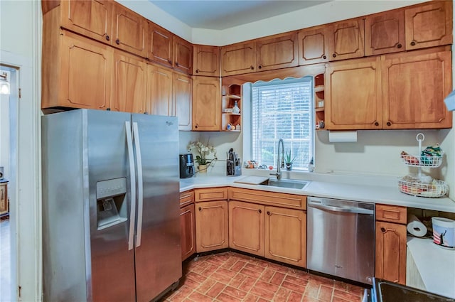 kitchen with sink and appliances with stainless steel finishes