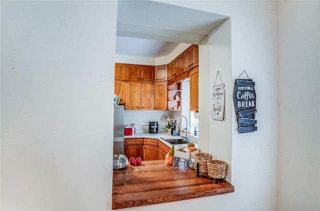 kitchen with stainless steel refrigerator and sink