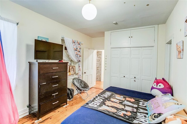 bedroom featuring a closet and light hardwood / wood-style floors