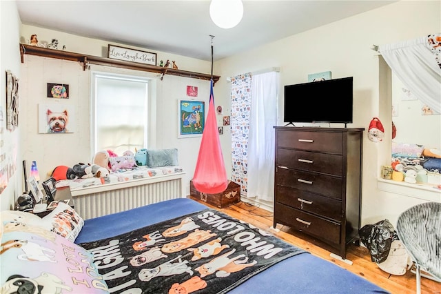 bedroom with light hardwood / wood-style flooring