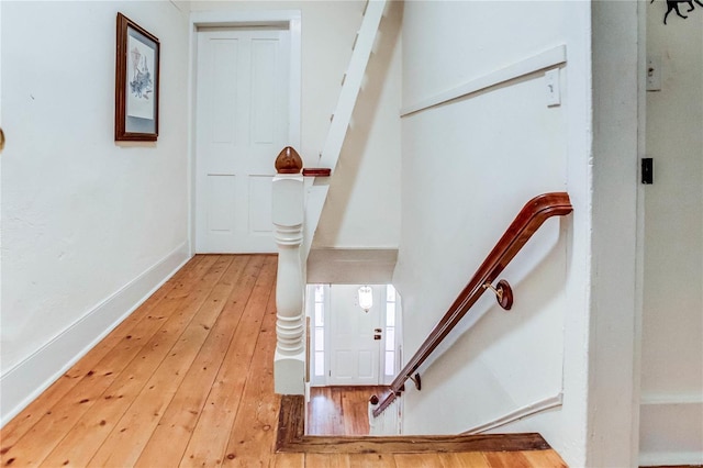 stairs with wood-type flooring