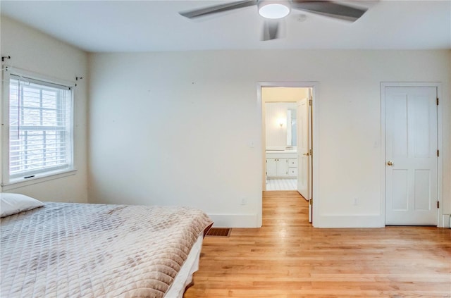 bedroom with ceiling fan and light hardwood / wood-style floors