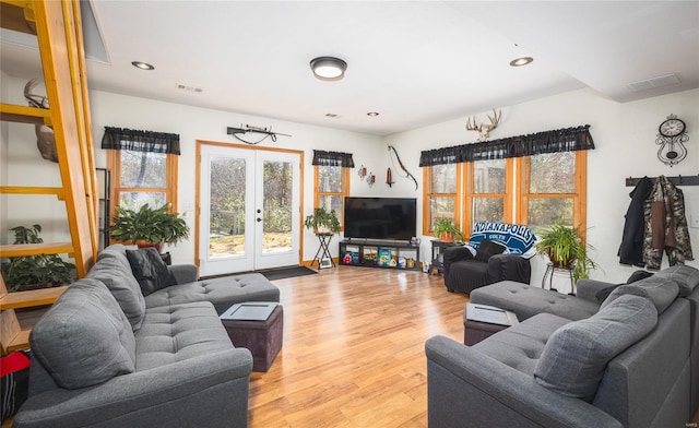 living room featuring french doors and hardwood / wood-style flooring