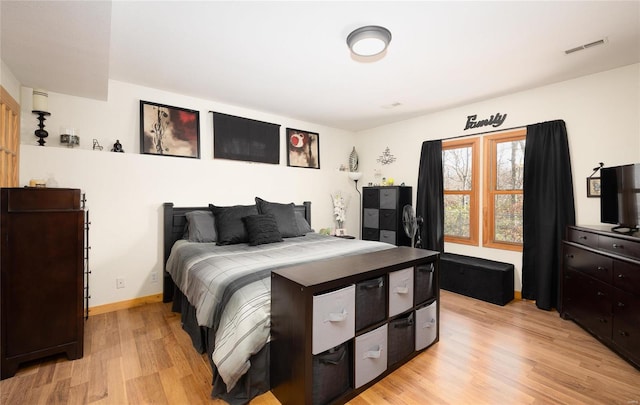 bedroom with light hardwood / wood-style floors