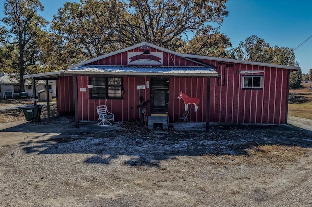 view of outbuilding with a carport