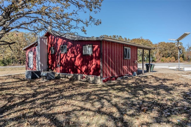 view of side of home featuring a yard