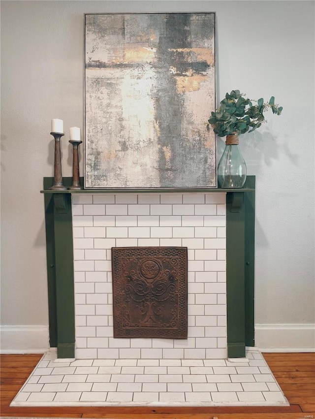 interior details featuring baseboards and wood finished floors