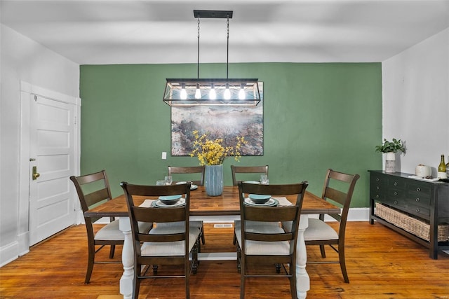 dining space featuring wood finished floors