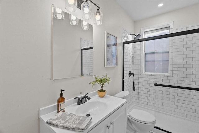 full bath with a baseboard heating unit, toilet, a stall shower, and vanity