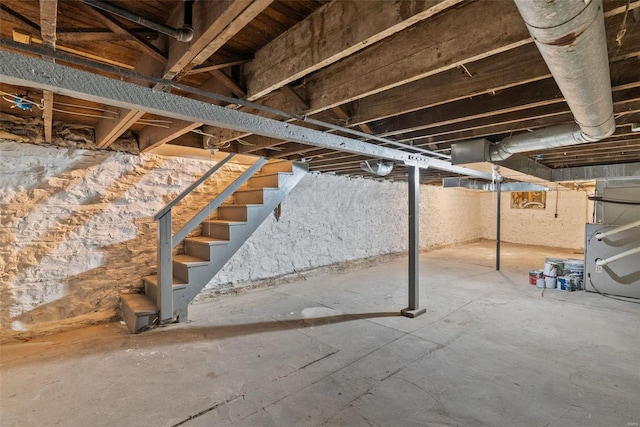 unfinished basement with stairs