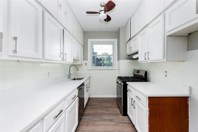 kitchen featuring sink, ceiling fan, stainless steel appliances, white cabinets, and dark wood-type flooring