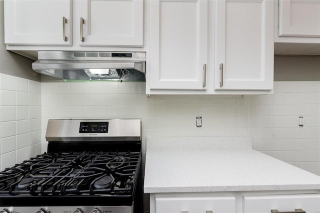 kitchen featuring white cabinetry, extractor fan, and stainless steel gas range oven