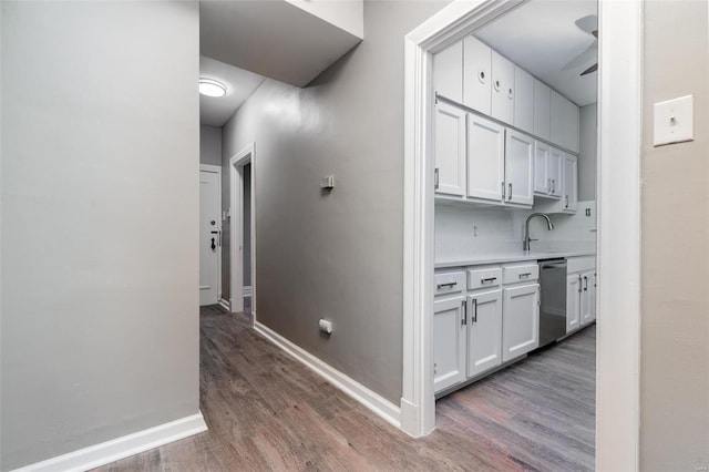 hall with sink and dark hardwood / wood-style flooring