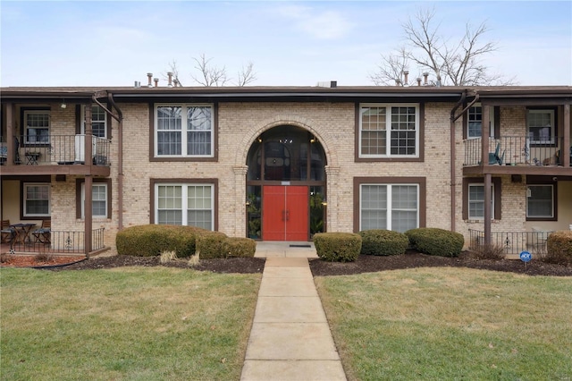 view of property with a front lawn