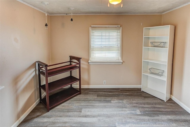 bedroom with ornamental molding, hardwood / wood-style floors, and ceiling fan