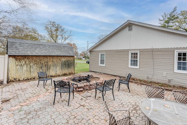 view of patio with an outdoor fire pit