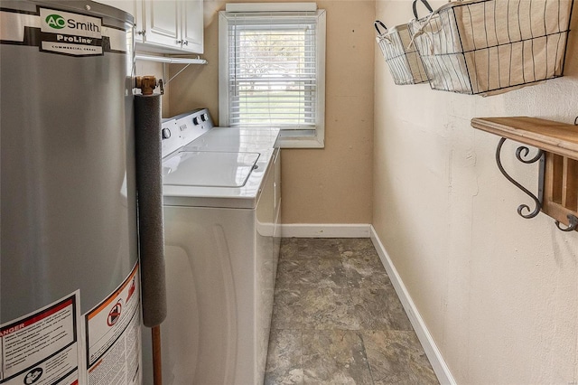 clothes washing area with water heater, cabinets, and independent washer and dryer