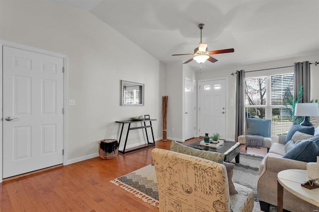 living room featuring light wood-type flooring, ceiling fan, and lofted ceiling