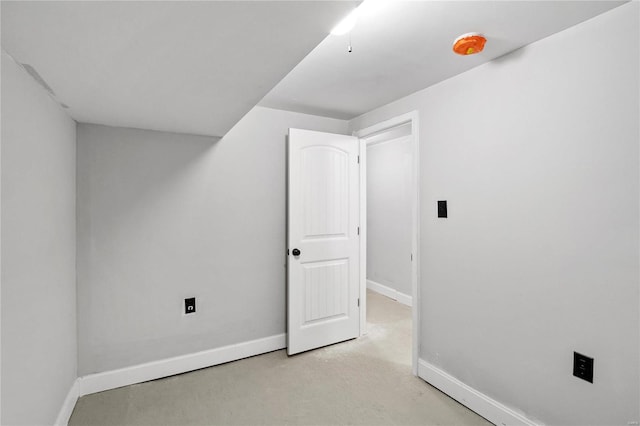 additional living space with light colored carpet