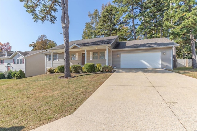 ranch-style home featuring a garage and a front lawn